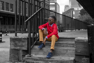 Stylish pre teen poses on steps of downtown Dallas