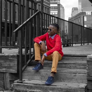 Stylish pre teen poses on steps of downtown Dallas